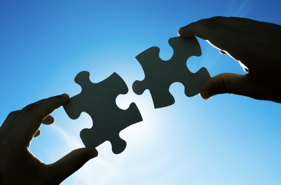 Puzzle pieces fitting together